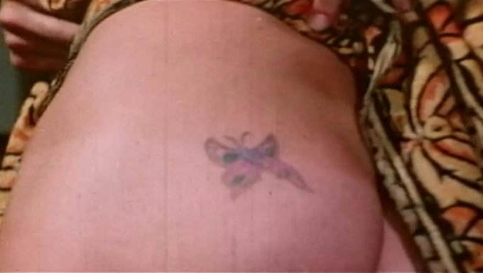 Retro Tattooed Lady In Vintage Grindhouse Film
