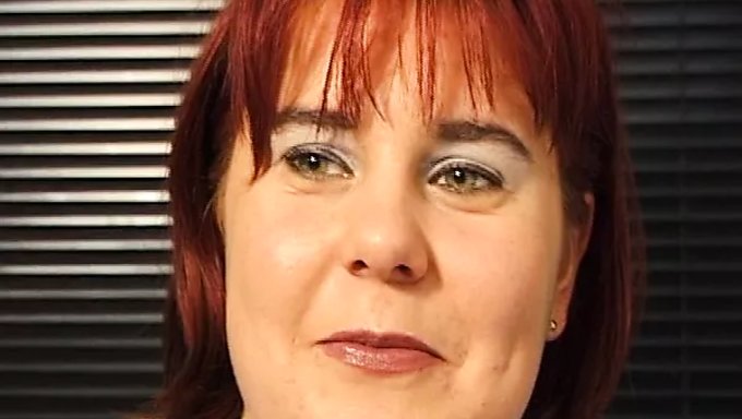 Mature Redhead Fingers A Banana In Steamy Video